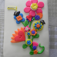 Button Flower Ninja Cake MMF covered cake. 4yr old asked for flowers, and the aunt was into martial arts, so I made some ninja's peeking out from behind the...