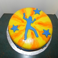 Retro Dance Cake MMF covered cake with MMF silhouette. Dye painted on for yellow and orange. A simple cake to say thanks to our dance instructor.