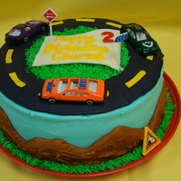 Charles' Cars Banana cake with cream cheese buttercreme. Car themed.