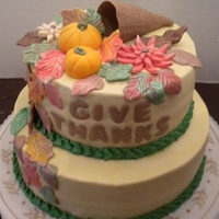 Giving Thanks Buttercream with fondant pumpkins & leaves