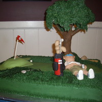 '19Th Hole" This cake was made for a golf outing. The tree is made from modeling choc, rice krispies and buttercream leaves. Man & golf bag made...