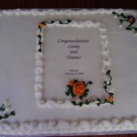 Busssheetcake.jpg 1/2 chocolate, 1/2 white sheetcake with buttercream icing and decorations. Made for a reception for a couple who married in Vegas earlier...