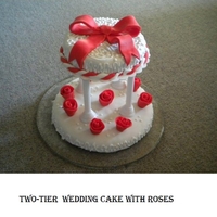 Two-Tier Wedding Cake With Roses My very first two-tier cake. I just wanted to practice, so I made my brother a birthday cake, which ended up being this wedding cake. He...