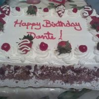 Marble Cake A cake I made for my sister's co-worker. Marble cake with Whipped icing, strawberries, cherries, and shaved chocolate on the side.