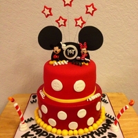 Mickey And Minnie Mouse Cake I made for twins, bottom tier buttercream, top tier fondant. Used my cricut cake for some of the details.