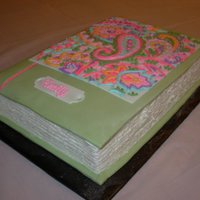 Emily - Volume 12 Birthday book done to coordinate with party plates. Volume 12 because it was for her 12th birthday. Fondant cover with buttercream piping...