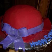 Red Hat Lady Cake this was made for a 50th birthday of a lady who was a member of the red hats, its covered in MMF and the brim and accents are MMF, thanks...