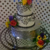 Black Scrollwork 8 and 6 inch. Cake topper was too large so I put it on the base of the cake plateau and used spare flowers to do the top myself. Bride...