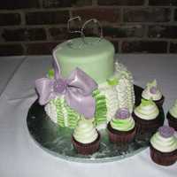 Teresa's Cake 8 and 6 inch round cakes. Ruffle on bottom was made with the rose tip. First time one of my bows actually came out looking alright!