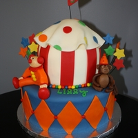 Lilly's 5Th Birthday Carnival Cake Carnival themed cake with a clown and monkey!