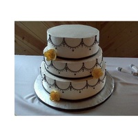 Black, White, & Yellow Wedding Simple piping with yellow sugar flowers. Inside was classic white, strawberry with cream cheese filling, and chocolate with cannoli cream...