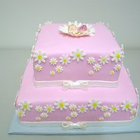 Daisy Baby Shower Cake Cake for a girl baby shower. Cake covered with fondant. All decorations are sugarpaste.