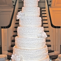 7 Tier Fondant Ruffled Cake With Gumpaste Topper 18" base up to 6" topper, buttercream cake with fondant ruffles- yep, I need hand surgery now! Gumpaste flower topper and accents...