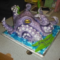 Octopus Its half sheer cake carved in the shape of the octopus covered in buttercream. the tips of the tentacle are made out of fondant and air...