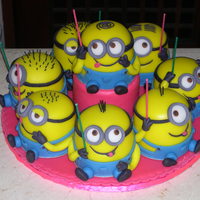 Minions eight minions for an eight year old girl; baked in 4" pans and covered/decorated in fondant