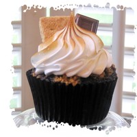 S'mores Cupcakes Chocolate cake with a graham cracker crust, sprinkled with crushed graham crackers before baking, iced with marshmallow frosting, which is...