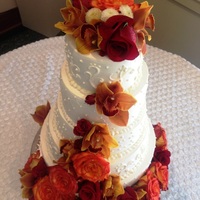 Five Tier Scroll Pattern Five Tier Scroll design with beautiful orange, red and brown roses, lillies etc. Vanilla Gluten Free Cake