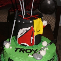 Golf - Forty 12" Cinnamon Swirl Cake. The top tier is 2 - 6" cakes. Golf clubs and balls are gumpaste.
