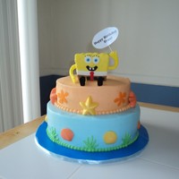 Spongebob Cake 10" chocolate cake, 8" vanilla cake. All iced in buttercream, chocolate seashells and starfish. I made spongebob out of RKT and...