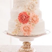 Mm Fondant Covered White Sour Cream Cake With Buttercream Filling The Flowers Are All Sugar Flowers The Top Layer Has A Piece Of Leftove MM fondant covered white sour cream cake with buttercream filling. The flowers are all sugar flowers. The top layer has a piece of leftover...