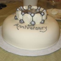 Eternity Ring Anniversary Cake Eternity ring cake. Wilton dome pan, Margie's Incredible Chocolate Cake, Buttercream Dream, MMF, "diamonds" are molded...