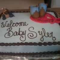 Cowboy Babyshower Cake This was for my cousin Christi. I found the idea for the boots somewhere on here. Decorations are in fondant.