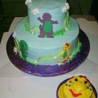 Barney & Friends - Bj Smash Cake 10 inch bottom tier, 6 inch top, 4 inch smash. The cake started to lien en route to customer's! I made an emergency pit stop at a...