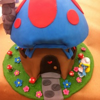 Smurf House Cake Top cake is key lime. Bottom cake is pistachio both with lemon buttercream and decorated with fondant. Everything else is made from...