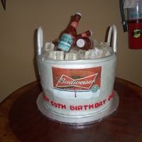Beer Bucket Isomalt bottles and ice - cake was buttercream with edible images on cake and bottles.