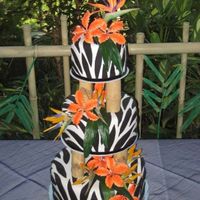 Zebra Print Zebra print with bamboo pillars. Gumpaste tiger lilies, silk birds of paradise and a gumpasste bird of paradise on top. Was done for a...