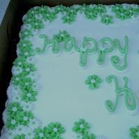 Kelly Green With Envy.... Half sheet Chocolate with strawberry filling and butter cream icing. Butter cream drop flowers.