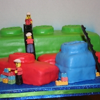 Lego Figures are made of gumpaste. Added some of the mini lego candies. Cakes are covered in Ronda's MMF. chocolate cake with bavarian...