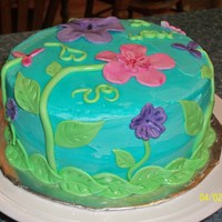 Flowers And Sky Butter Pecan cake with white chocolate mousse filling. Fondant flowers and leaves, buttercream icing.