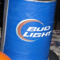 Beer Can Birthday Cake Vanilla cake with buttercreme icing. Letters top and side stripes are fondant and circle is printed on sugar sheet.