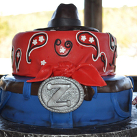 Jean, Bandana, Cowboy Hat Cake Two tier cake covered in fondant. Used gel paints to add accents to the jeans.