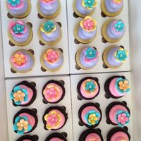 6Th Birthday Cupcakes! Cupcakes for a little girl's class at school for her 6th birthday! Purple & pink w/ multi-colored fondant flowers