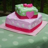 Pink And Green W/ Polka Dots/heart I did this one for my neice's 4th bday. Buttercream w/ fondant dots, heart and roses. Ribbon trim.