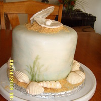 Seashell Anniversary Cake Handpainted beach scene with molded chocolate shells.
