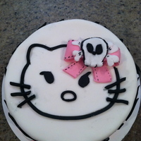 Hello Kitty This was a request from my niece who likes the angry goth Hello Kitty version. It is a fondant cake with zebra stripes. I cut the Hello...