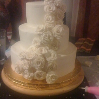 Cascading Roses Wedding Cake The bride wanted a simple white/ivory cake with cascading roses. All buttercream.