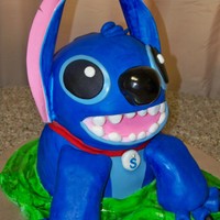 Blue Alien That Sort Of Resembles The Licensed Character Stitch Cake Stitch is licensed so everyone...meet Stotch! Ears are gumpaste and everything else is MMF. Thanks for looking!