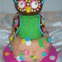 Owl-Themed 1St Birthday Done to match her outfit and an idea the mom wanted me to replicate. All cake except for owl's head RCT. Covered in MMF. TFL!