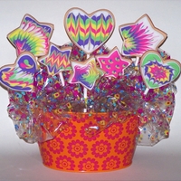 Cookie Bouquet Centerpiece Heart and Star shaped Cookies on sticks are fun and a make a great centerpiece. Almond flavored royal icing thinned for glazing cookies in...