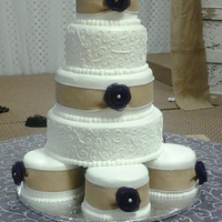 5-Tier Wedding Cake base is five 6" cakes then 12, 10, 8 and 6. Some white and some Strawberry tiers. Burlap ribbon with pearl edging and eggplant organza...
