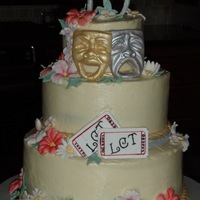 10Th Anniversary Theatre Butterscotch cake with vanilla/strawberry buttercream filling; Buttercream frosting with all fondant decorations.