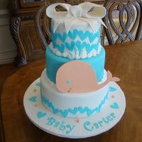 Kristi's Baby Shower 10, 8 and 6 inch tiers covered in fondant. Bow and whale were made with gum paste. TFL!