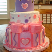 Princess Carley's Cake Dark chocolate fudge cake with chocolate mousse filling. Vanilla BC frosting and fondant accents. Crown and bow are gumpaste. TFL!