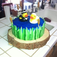 Duckie's In Love all fondant with plastic rubber duckies, the base is a real tree stump