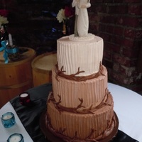 Graduating Chocolate Buttercream Wedding Cake Combed buttercream with chocolate fondant branches & twigs. The bride came up with the design from a picture she saw . Sorry I can'...