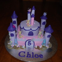 Castle Cake Bottom layer eggless Chocolate Mud cake, top layer white mud cake, cover with Satin Ice Fondant.